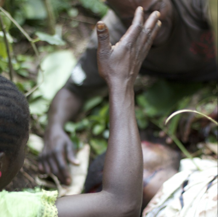A family mourns a massacre victim in Mokoko, Ocotber 2014 (Photo: Dearbhla Glynn)
