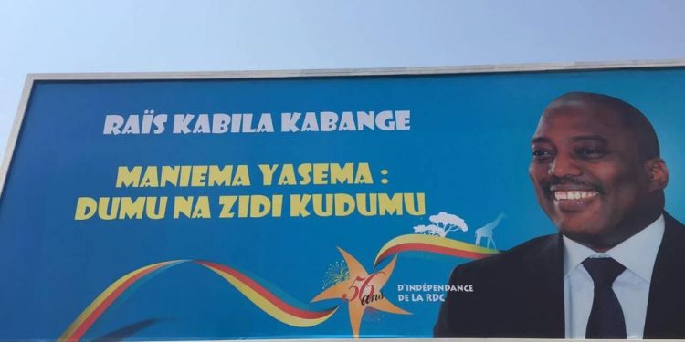 Billboard in Kindu: "Maniema says––Stay long and continue to stay"