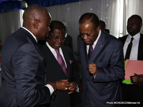 The facilitator of the dialogue, Edem Kodjo, with Vital Kamerhe and Thambwe Mwamba