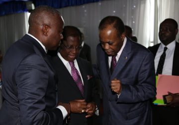 The facilitator of the dialogue, Edem Kodjo, with Vital Kamerhe and Thambwe Mwamba